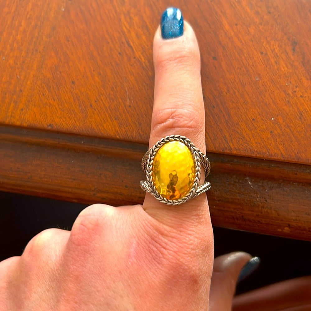 Gold& silver flat long oval shaped ring. Top is gold oval, sides are silver.